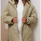 Corvaya™ – oversize-talvitakki hupulla